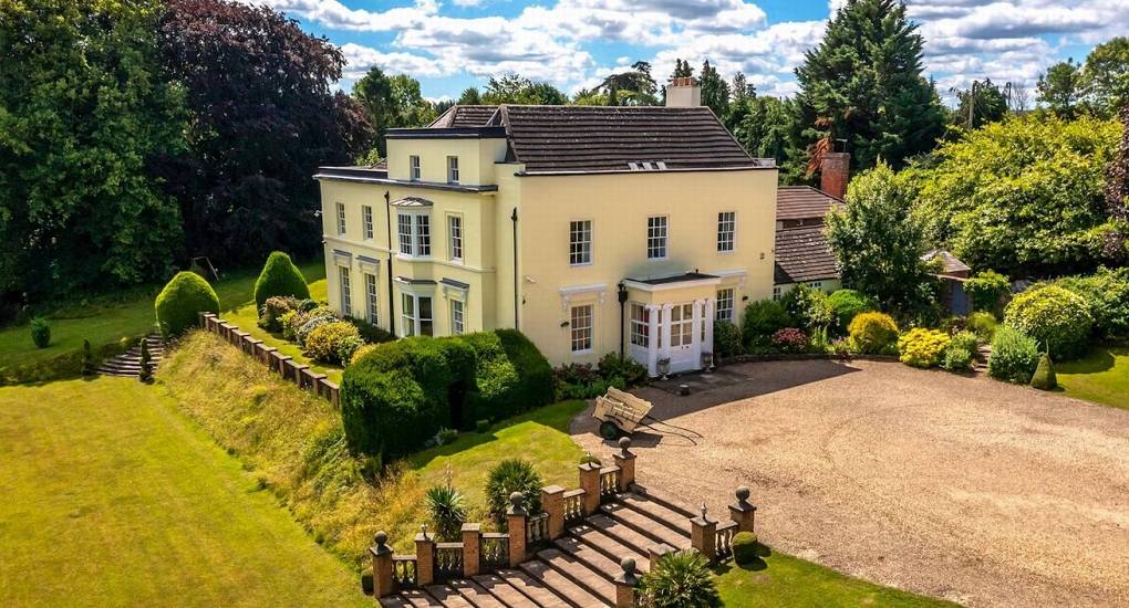 The beautiful exterior of Rivers Countryside Mansion, showing the elegant grounds and spacious driveway for large hen parties.