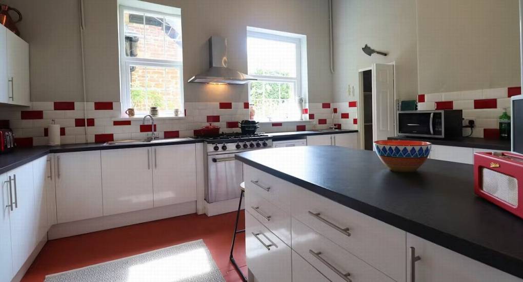 The large professional-grade kitchen at Rivers Countryside Mansion with a gas range, ideal for catering for a hen party of up to 36.