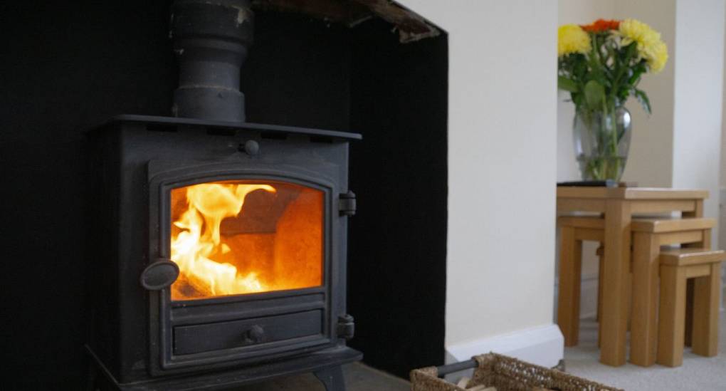 Fireplace in lounge with roaring fire