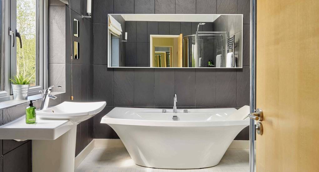 Premium en-suite bathroom at Spa Town, one of six luxury bathrooms in this Cheltenham hen house with a pool.