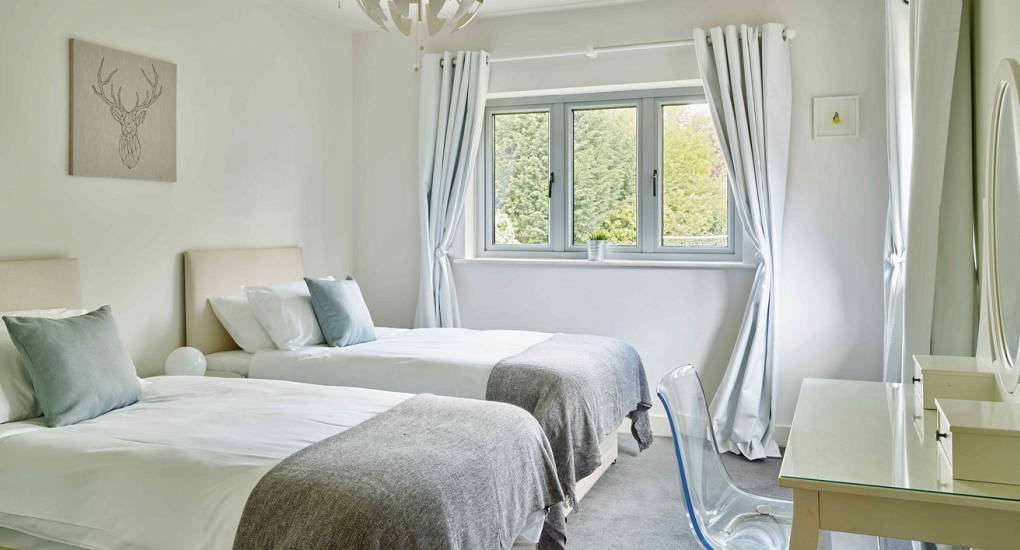 Twin single bedroom at Spa Town, a spacious Cheltenham hen party house sleeping up to 24 guests.