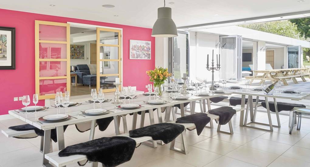 Large open-plan dining area at Spa Town, a luxury Cheltenham hen party house with space for 24 guests to eat together.