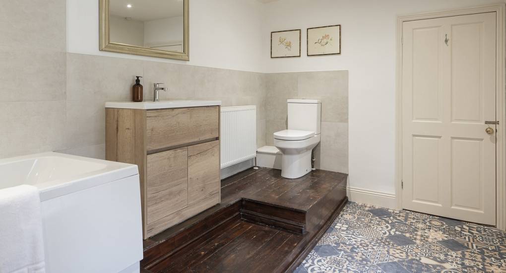 Large bathroom suite with bath, shower and toilet