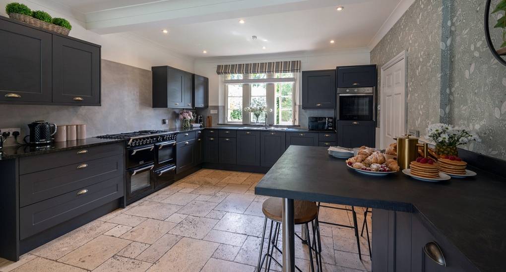 Spacious social kitchen at Summerset House: A luxury Bath hen party house with a modern, fully equipped kitchen for large groups.