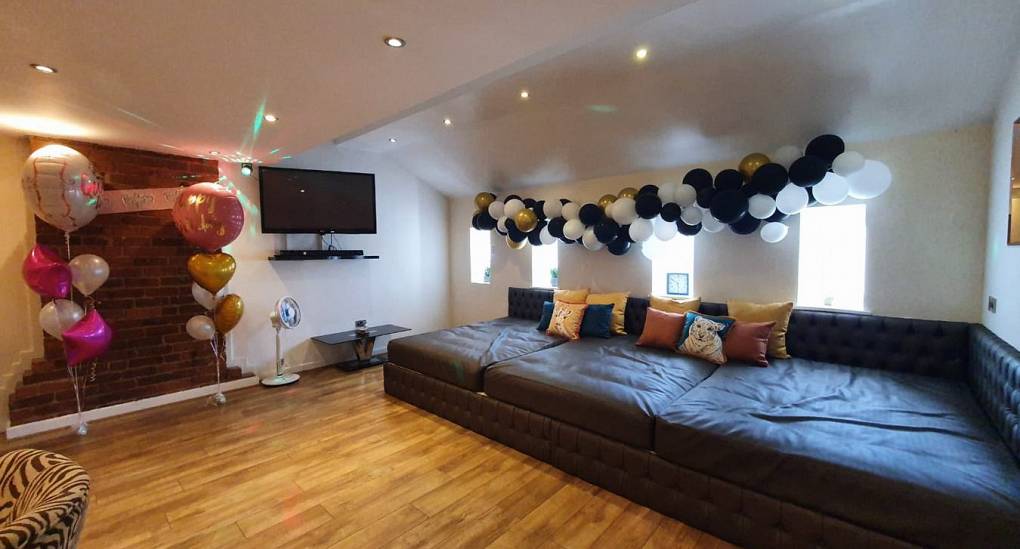 Stag and Hen party home lounge with party decorations 