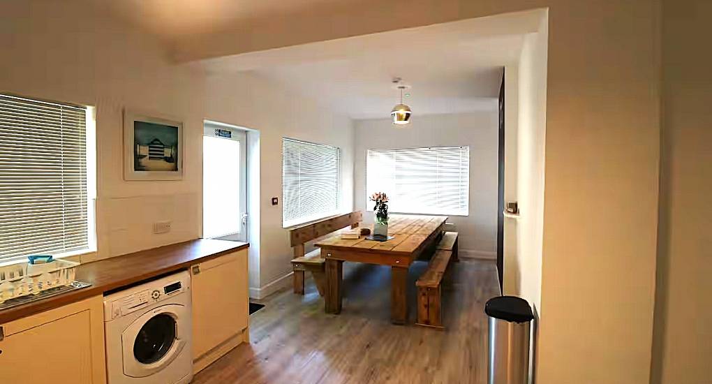 Kitchen leading through to dining table