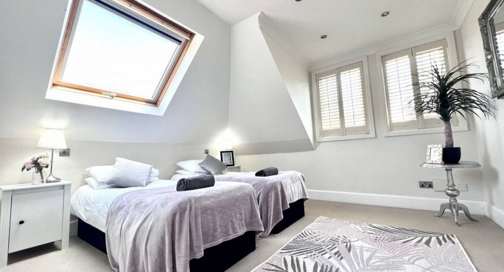 Double bedroom with floor space and sky light