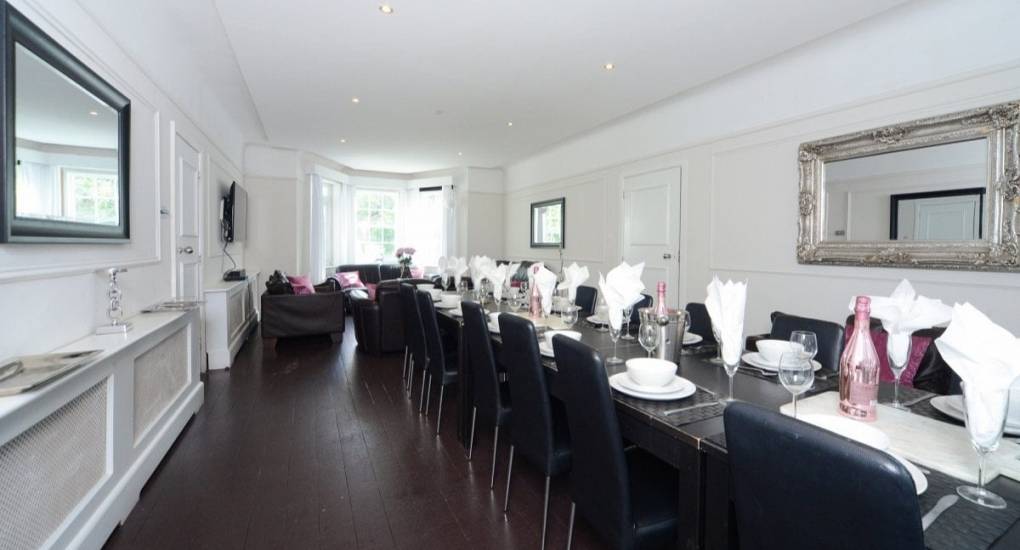 Long view of the dining room table and chairs