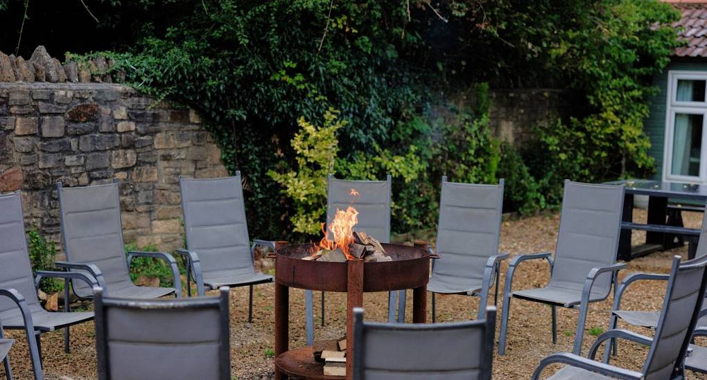 Fire pit in garden with seating