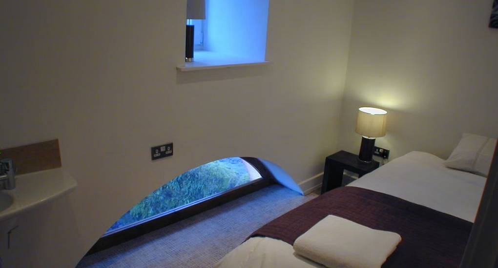 Double bedroom with moon shaped window