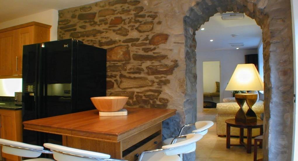 Stone archway leading to the kitchen 