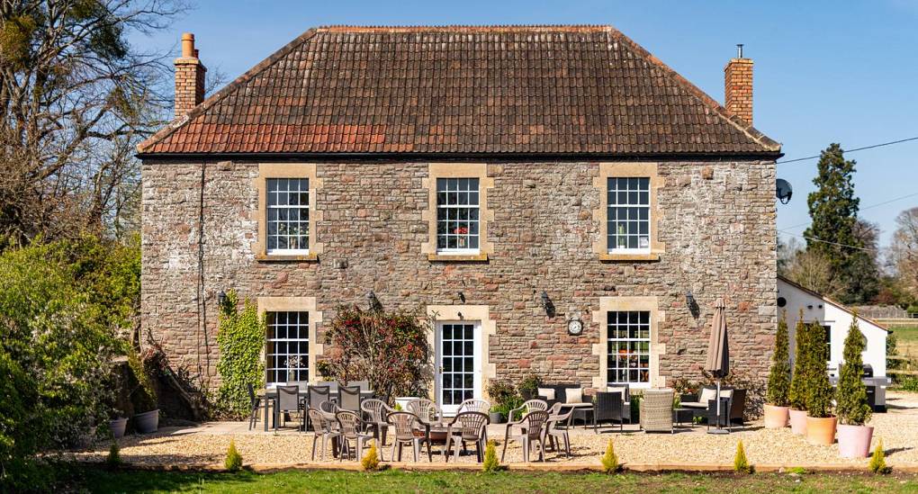 Rear of house with seating around the fire pit