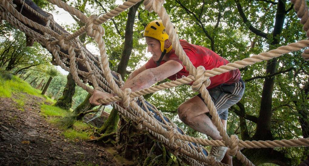Stag tackles the scramble net assault course obstacle