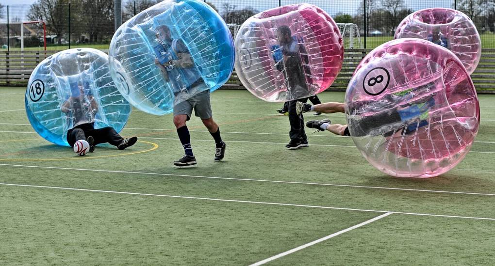 Stag party kicking off playing Bubble Football