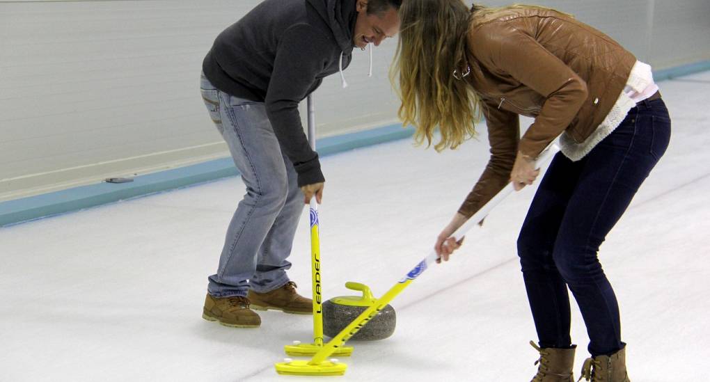 Young couple enjoying some Curling