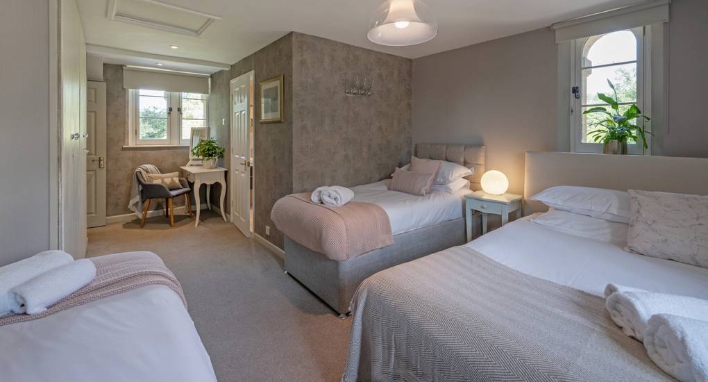 Luxury hen house near Bath: Bedroom 4 at Summerset House with one double and two single beds and private en-suite.
