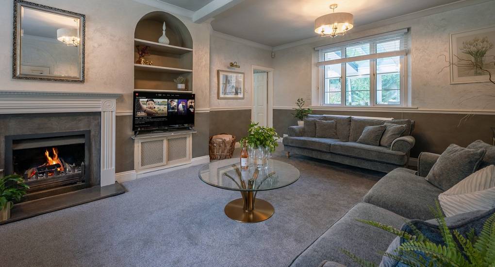 Spacious social lounge at Summerset House: Luxury Bath hen party house with large group seating, perfect for evening drinks and hen activities.