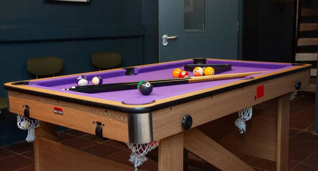 Purple pool table at the Cardiff stag accommodation The Bunnkhouse 