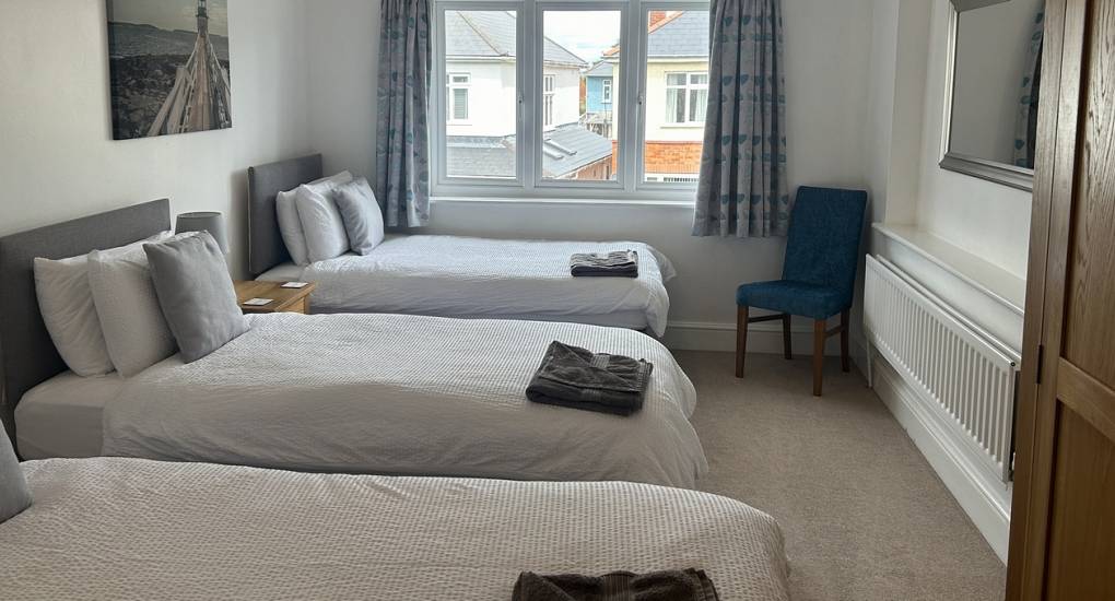 One of the bedrooms in the Charming House in Bournemouth