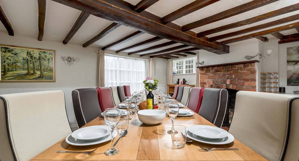 The dining area in the secret garden stag do house in the New Forest