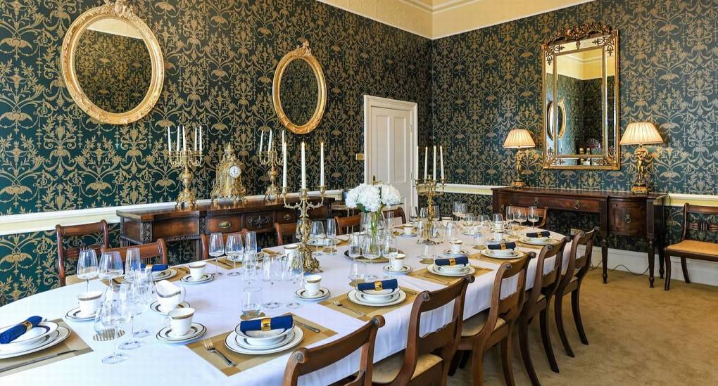 Regency-style dining room with a long table for group meals at The Parsonage Nottingham hen party house.