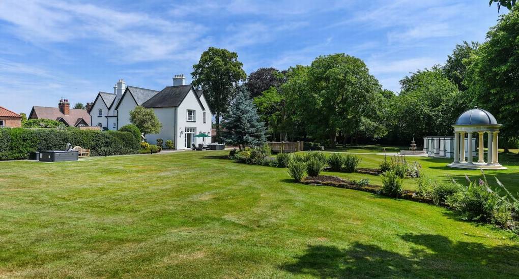 Secluded outdoor seating and garden area for hen groups at The Parsonage manor house in Nottinghamshire.