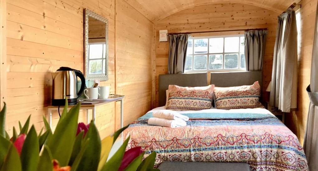 The bedroom inside the Shepherds hut at the Forest Tree House