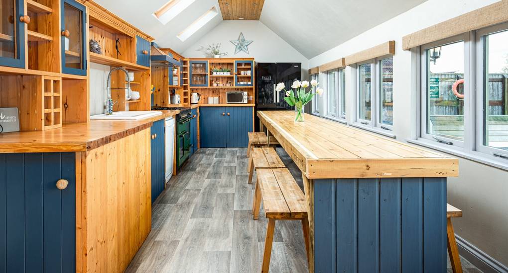 The rustic kitchen area in the Villa Bath party house