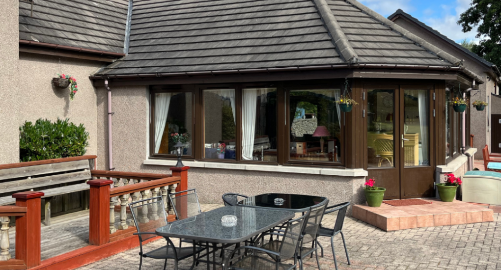 View of the patio area and conservatory