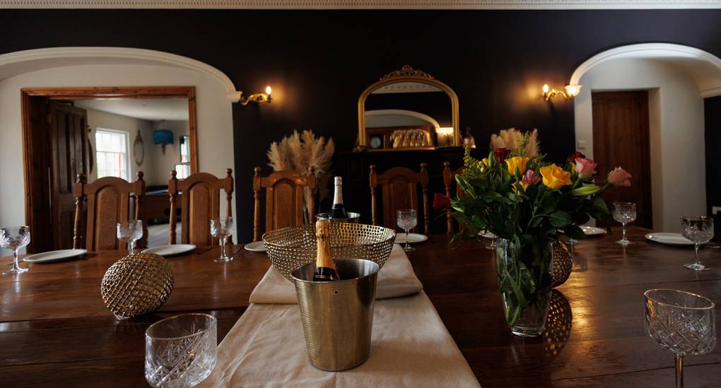 Regal Manor 1 Party House dinging room with large dining table 