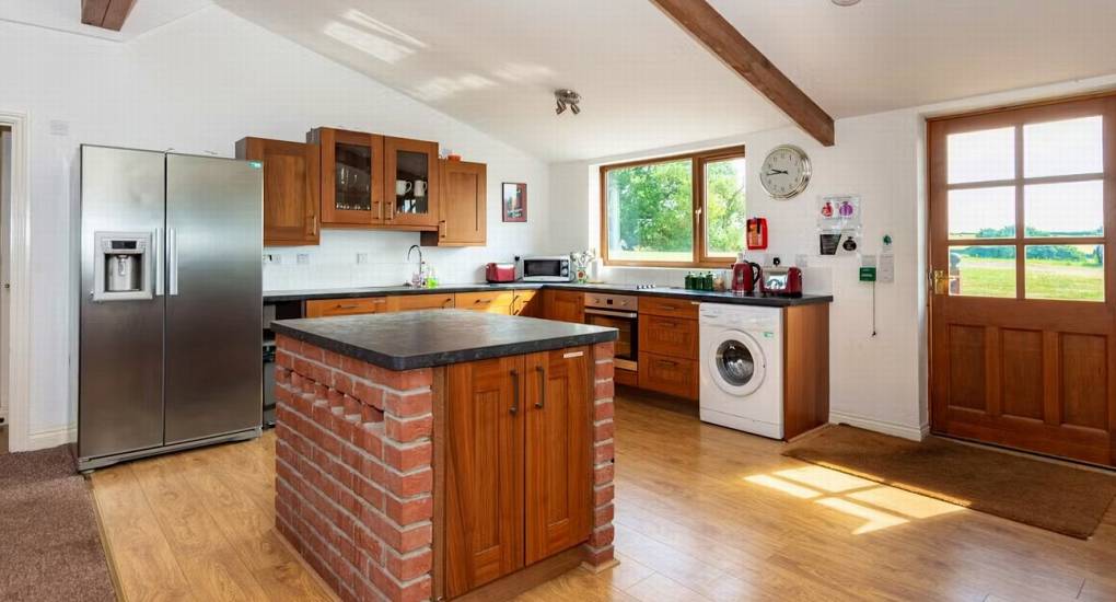 The rustic kitchen area at Monmouthshire hen party cottage Horizon View