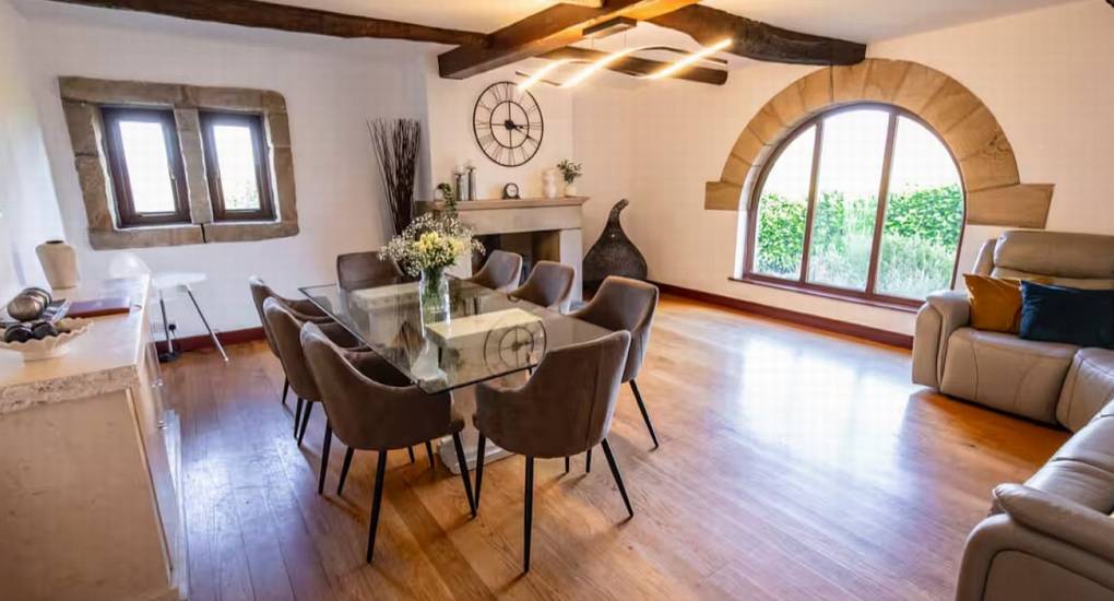 Comfortable dining and lounge area for group meals at The Stabletree Hen Party House