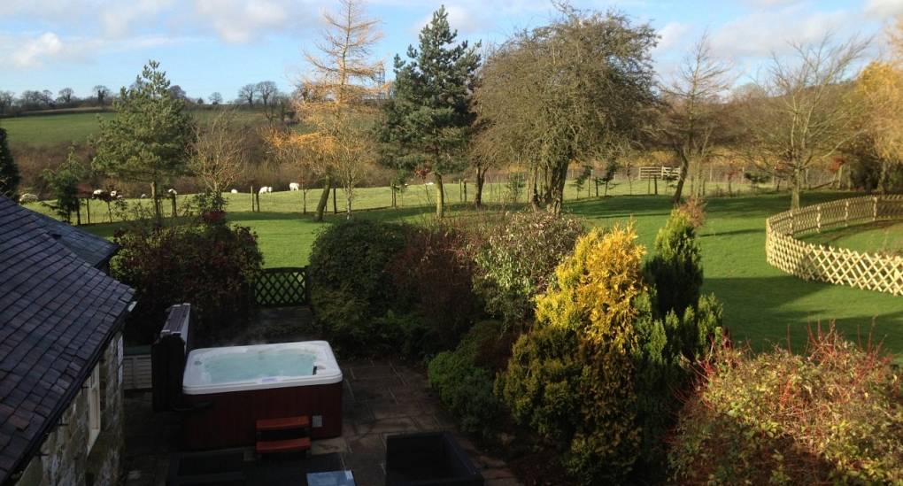 View from up high of the gardens and hot tub