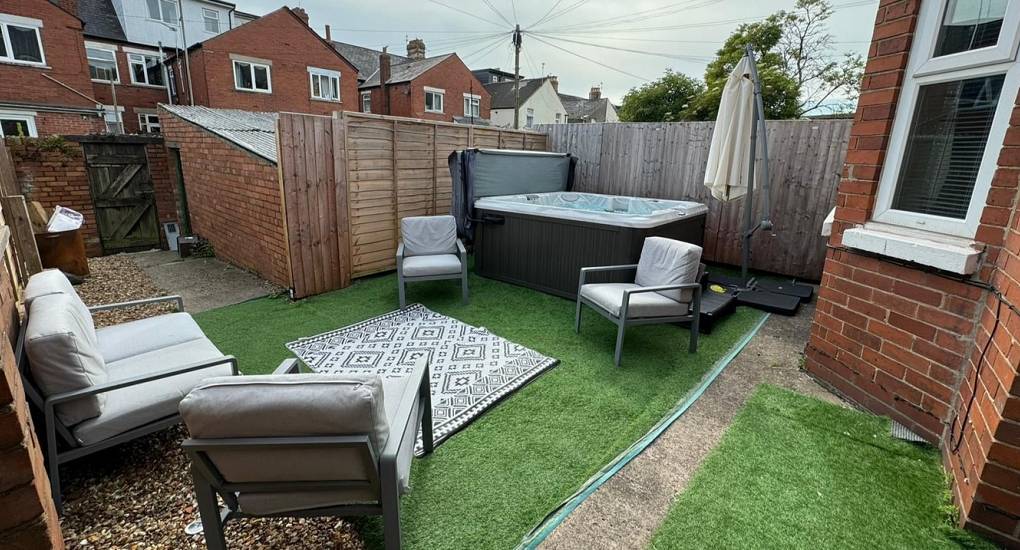 The garden area makes for a perfect setting for the state of the art hot tub at the Upper Decks Party House in Cardiff