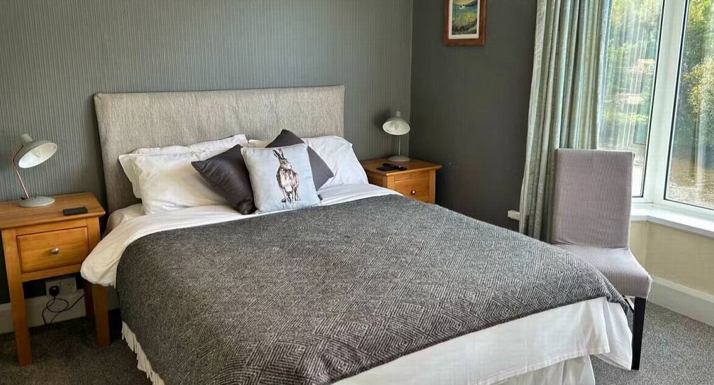 A stylish double bedroom at White Horse House, offering comfortable hen weekend accommodation in Herefordshire for a group that sleeps 30.