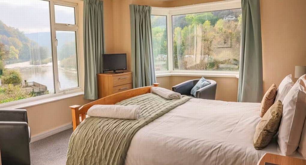 One of the comfortable double bedrooms at White Horse House with a stunning river view, ideal hen weekend accommodation in Herefordshire for up to 30 guests.