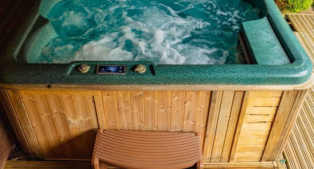 A close-up view of the bubbling hot tub at The Wye House, which is a perfect luxurious feature for a Herefordshire hen party house that sleeps 22.