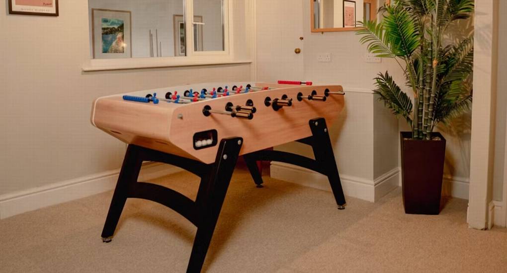 A view of the table football game in the dedicated games room at The Wye House, providing fun entertainment for a Herefordshire hen party group that sleeps 22.
