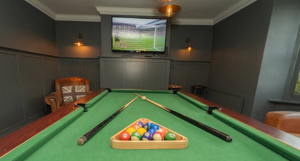 A close-up view of the professional pool table at Tranquil Escape, showcasing the Sky Sports package available for hen and stag groups staying at this detached private estate near Newcastle.