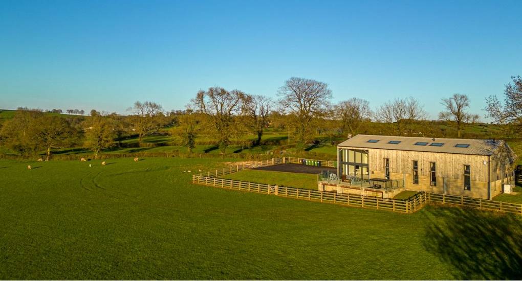 Wide exterior view of the Tree View converted barn: Large Peak District Hen Party House