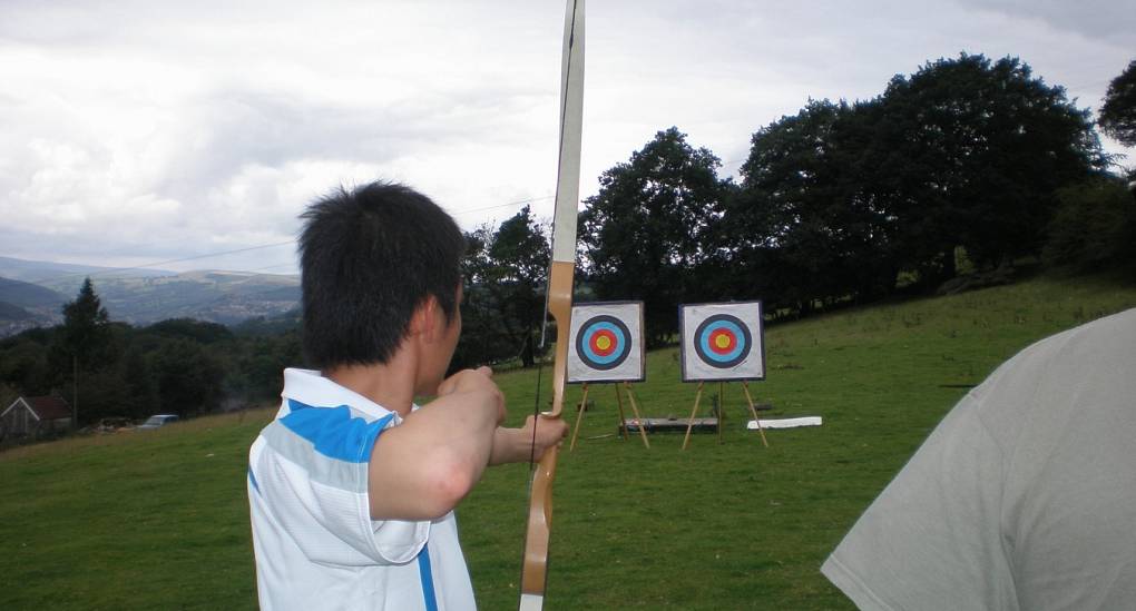 One of the stag do taking aim in the Archery 