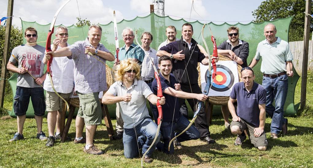 Group on a stag do pose for archery picture