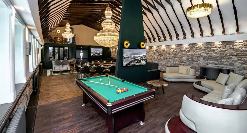 Alternate view of the open plan living space with pool table as the focus