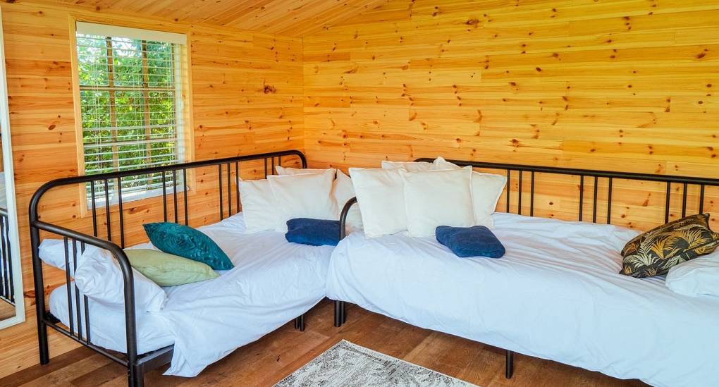 Two single beds in separate lodge