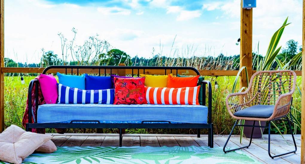 Colourful garden bench on the decking