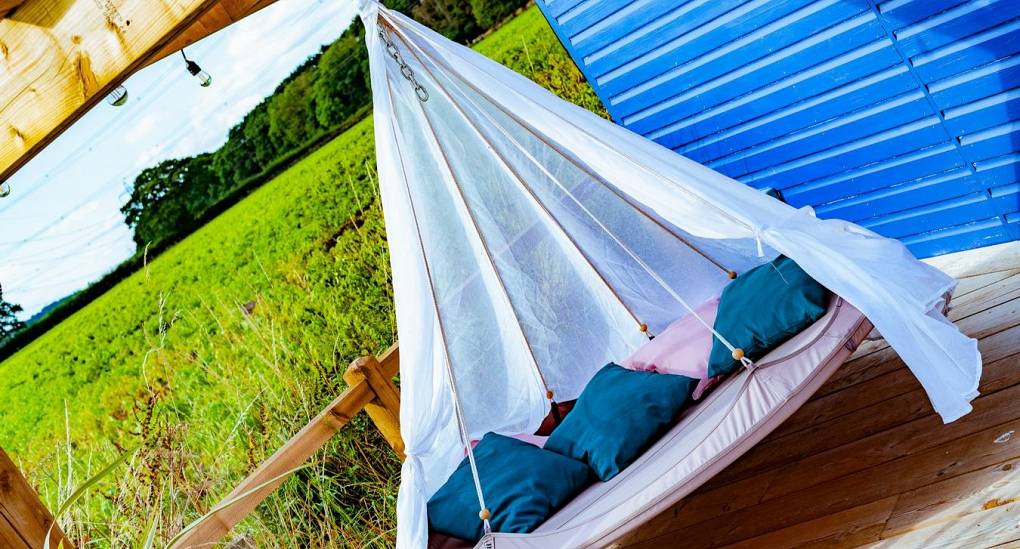 Large swinging chair in garden 