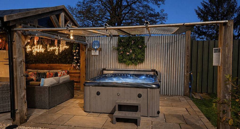 The gazebo covered outdoor hot tub at Shire House, stylish York hen do accommodation sleeping 18.