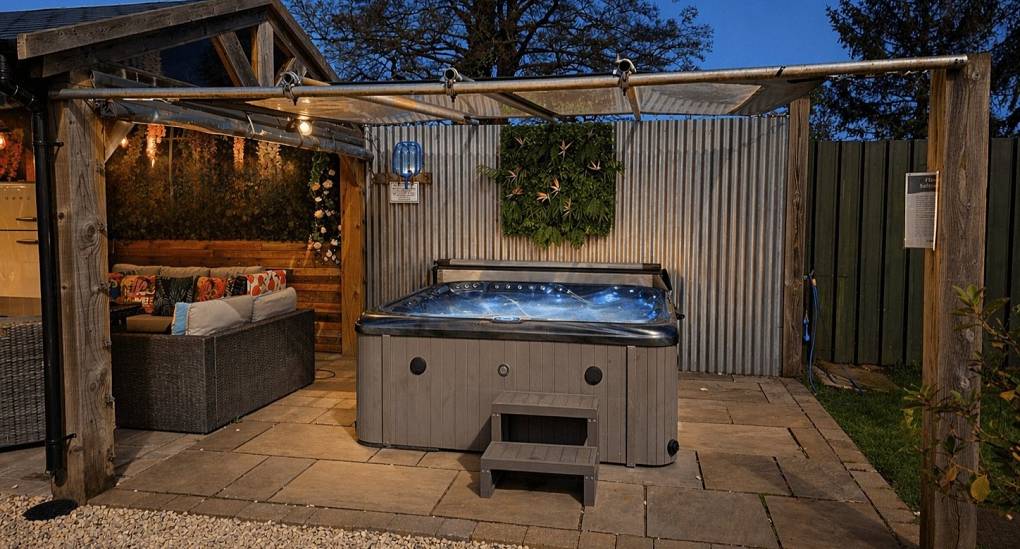 The gazebo covered outdoor hot tub at Shire House, stylish York hen do accommodation sleeping 18.